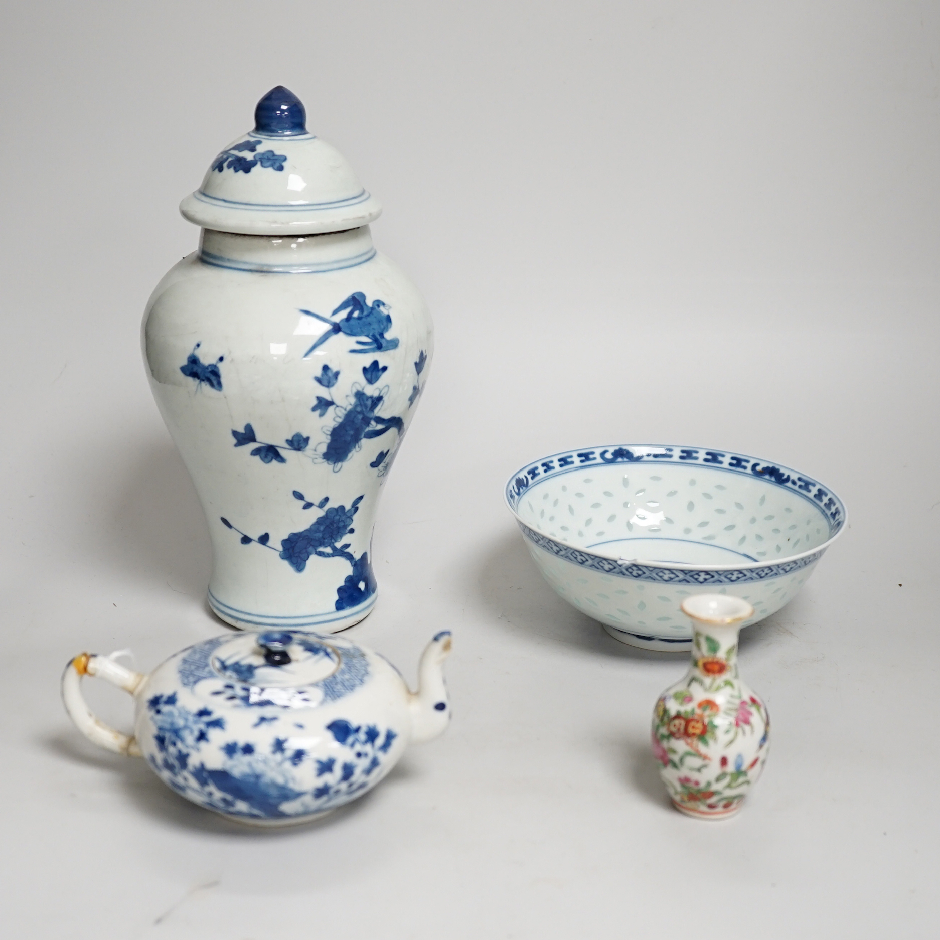 Chinese blue and white ceramics and a miniature famille rose vase, the largest 25cm high